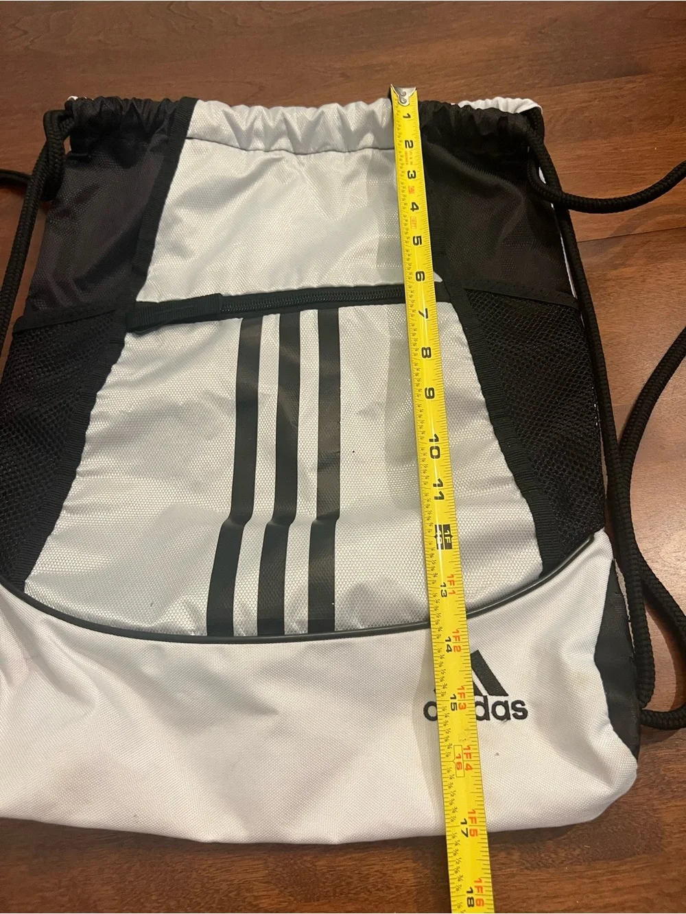 adidas White and Black Drawstring Backpack with Front Zip Pocket